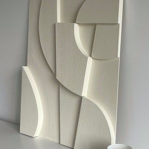 Textured and minimalist graphic wall piece. Modern monochromatic shapes. Minimalist style decor. Art sculpture.