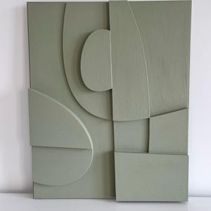 Textured and minimalist graphic wall piece. Modern monochromatic shapes. Minimalist style decor. Art sculpture.