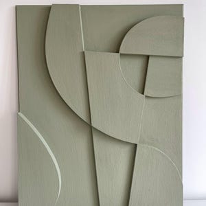 Textured and minimalist graphic wall piece. Modern monochromatic shapes. Minimalist style decor. Art sculpture.