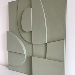 Textured and minimalist graphic wall piece. Modern monochromatic shapes. Minimalist style decor. Art sculpture.