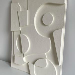 Textured and minimalist graphic wall piece. Modern monochromatic shapes. Minimalist style decor. Art sculpture.