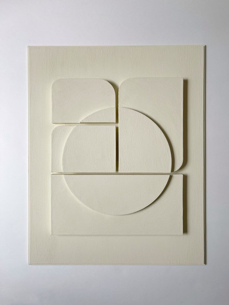 Textured and minimalist graphic wall piece. Modern monochromatic shapes. Minimalist style decor. Art sculpture.