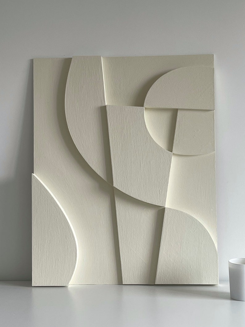 Textured and minimalist graphic wall piece. Modern monochromatic shapes. Minimalist style decor. Art sculpture.