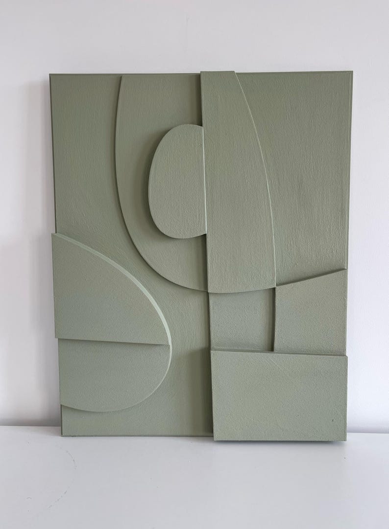 Textured and minimalist graphic wall piece. Modern monochromatic shapes. Minimalist style decor. Art sculpture.