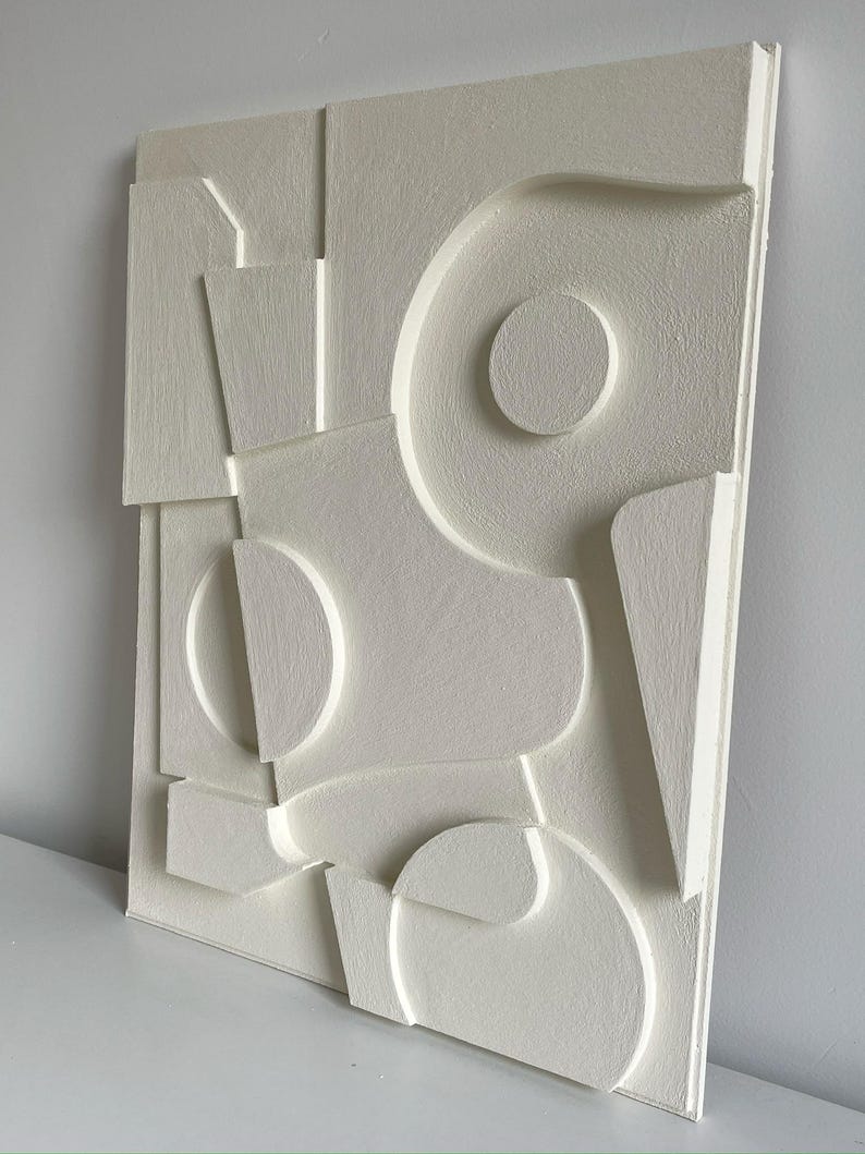 Textured and minimalist graphic wall piece. Modern monochromatic shapes. Minimalist style decor. Art sculpture.