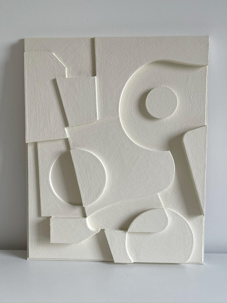 Textured and minimalist graphic wall piece. Modern monochromatic shapes. Minimalist style decor. Art sculpture.